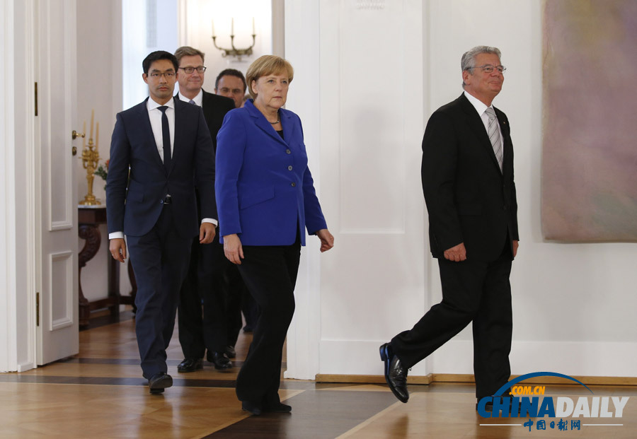 德国总统宣布默克尔现任政府解散 组阁紧锣密鼓（高清组图）